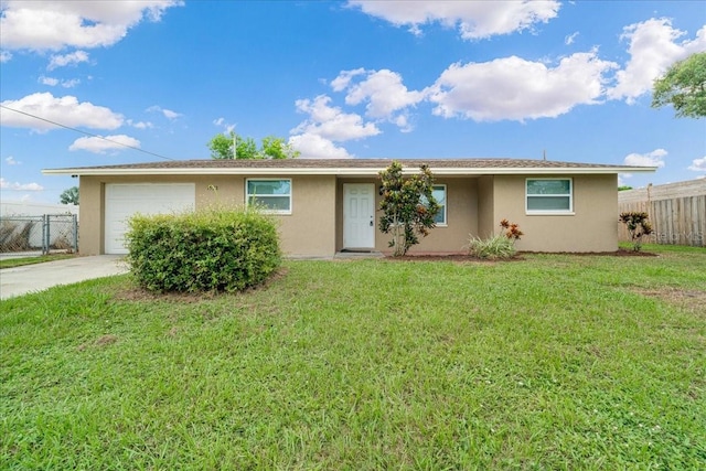 single story home with a garage and a front yard