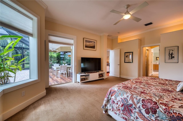 carpeted bedroom with ornamental molding and ceiling fan