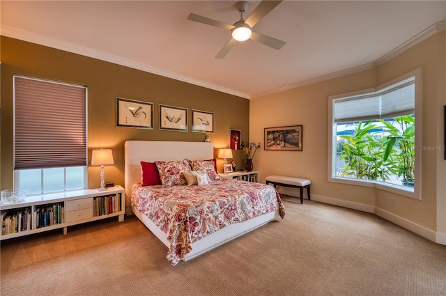 bedroom with crown molding, carpet flooring, and ceiling fan