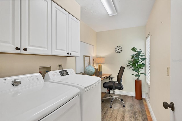 washroom with baseboards, cabinet space, independent washer and dryer, and light wood finished floors