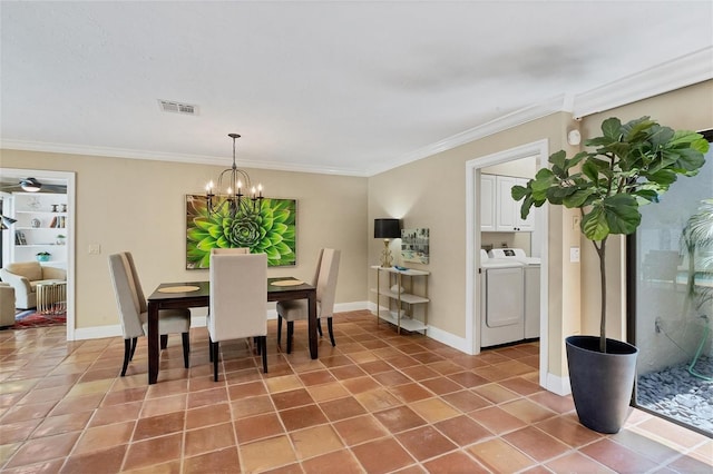 tiled dining room featuring baseboards, visible vents, ornamental molding, and independent washer and dryer