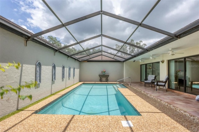 pool featuring a lanai, a patio area, and ceiling fan