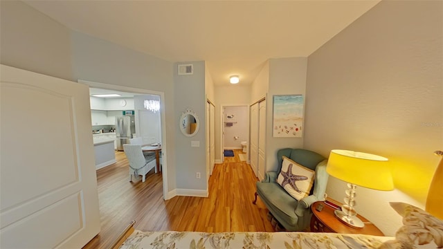 sitting room with light hardwood / wood-style floors