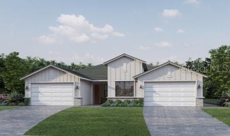 view of front facade with a garage and a front lawn