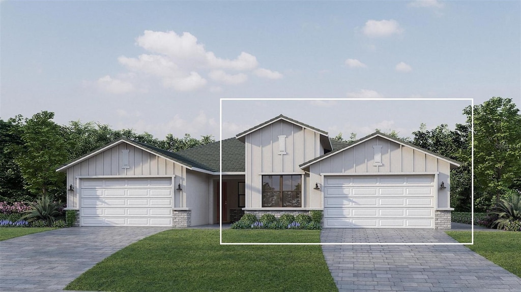 view of front facade with a garage and a front lawn