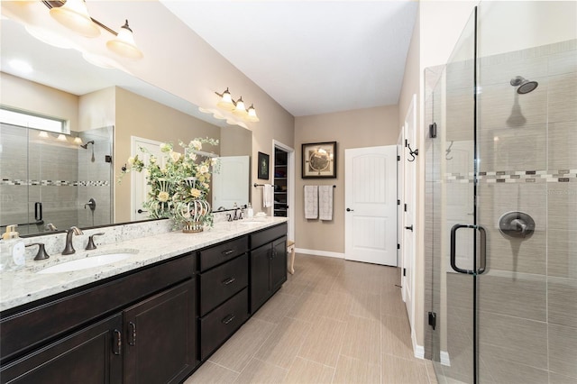 bathroom with vanity and a shower with shower door