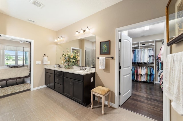 bathroom featuring vanity and wood-type flooring