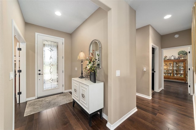 foyer entrance with dark hardwood / wood-style floors