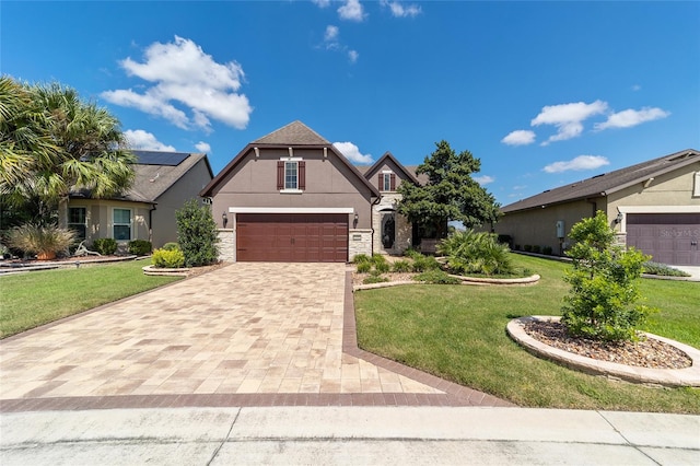 view of front of house with a garage and a front yard