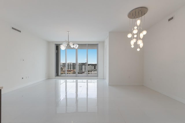 unfurnished dining area with a wall of windows, light tile patterned floors, and a notable chandelier