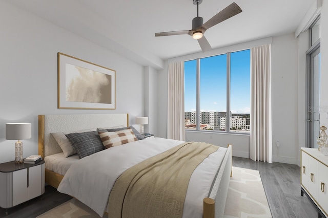 bedroom featuring light hardwood / wood-style floors and ceiling fan