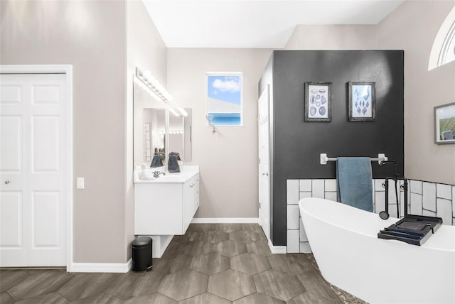 bathroom featuring vanity and a bathing tub