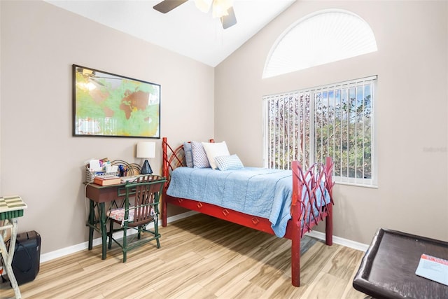 bedroom featuring ceiling fan, high vaulted ceiling, and light hardwood / wood-style floors