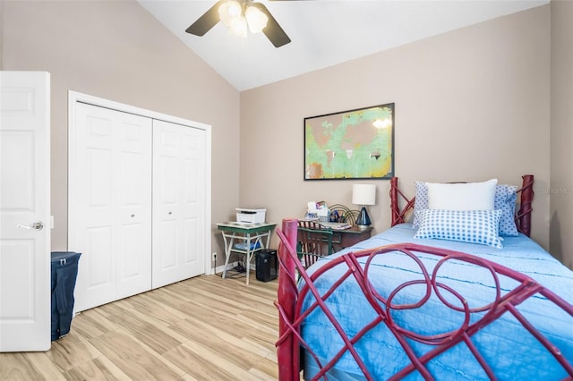 bedroom featuring wood-type flooring, vaulted ceiling, a closet, and ceiling fan