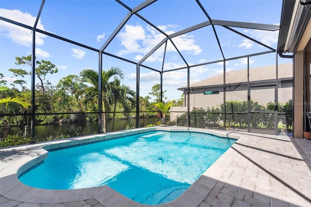 view of swimming pool featuring a lanai, a patio area, and a water view