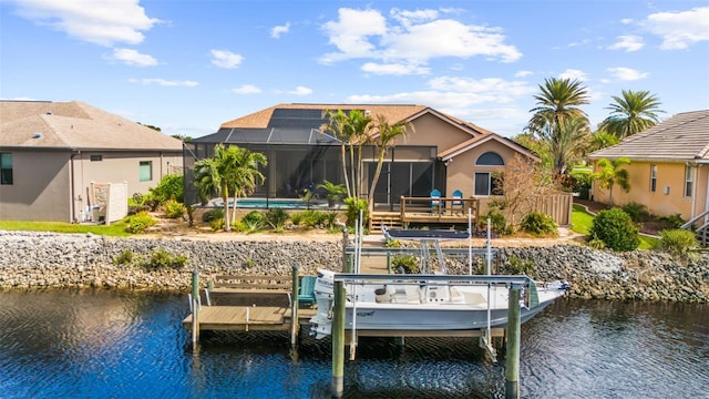 view of dock featuring glass enclosure and a water view