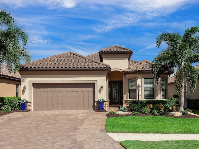 mediterranean / spanish house featuring a garage