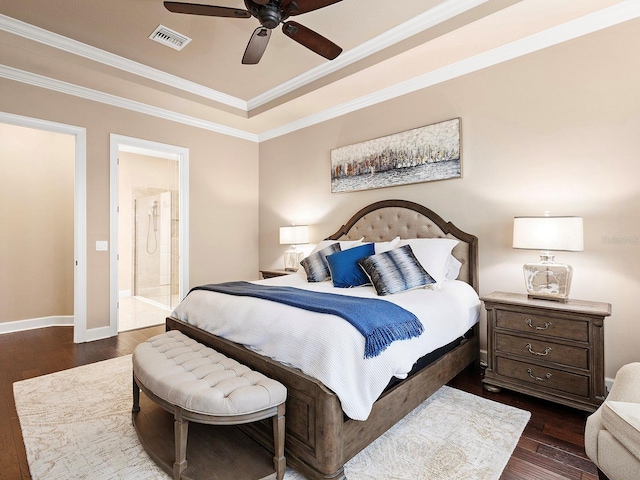 bedroom featuring ornamental molding, connected bathroom, dark hardwood / wood-style flooring, and ceiling fan