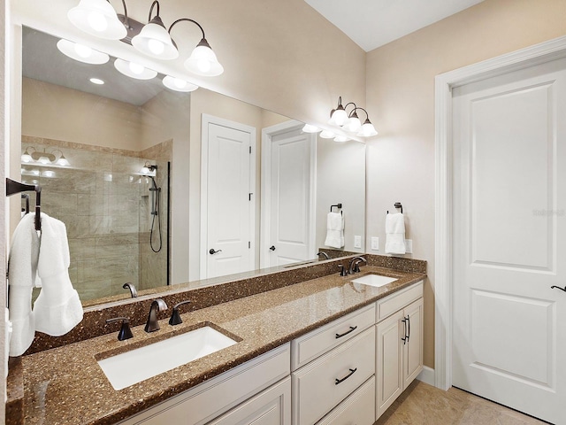 bathroom with tile patterned flooring, a shower with door, and vanity