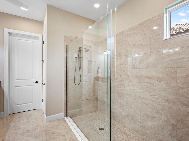 bathroom featuring tile patterned flooring and a shower with door