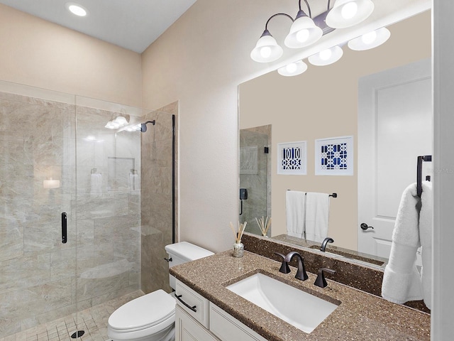 bathroom featuring walk in shower, vanity, and toilet