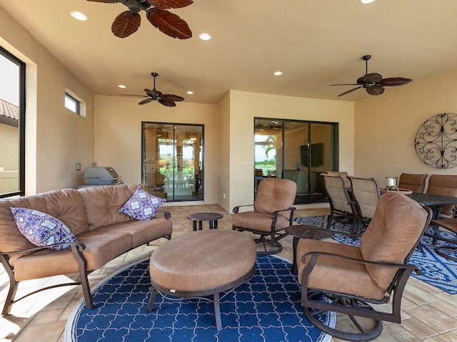 view of patio featuring ceiling fan and outdoor lounge area