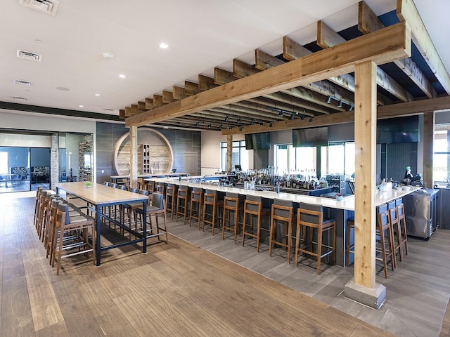 dining space featuring light hardwood / wood-style flooring and a wealth of natural light