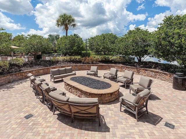 view of patio / terrace featuring an outdoor fire pit