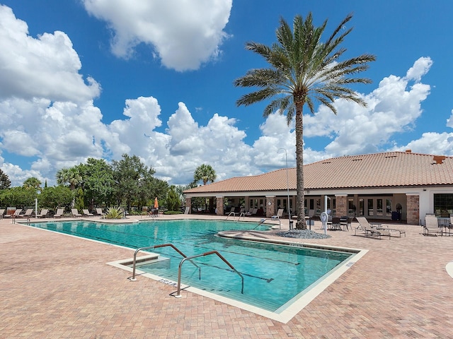 view of pool featuring a patio