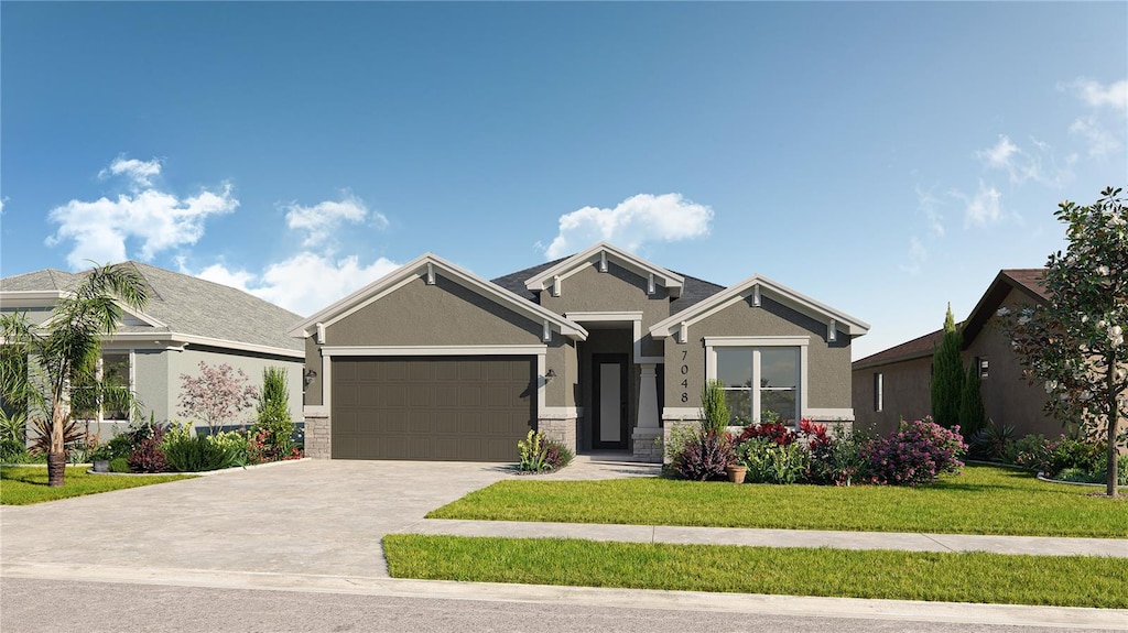 view of front of property featuring a garage and a front lawn