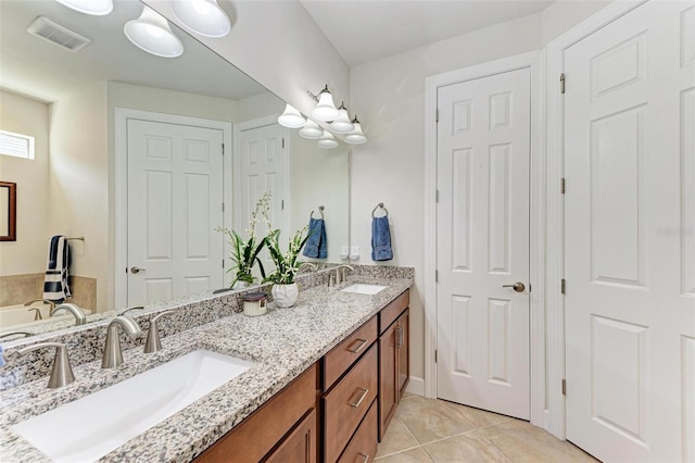 bathroom with vanity and tile patterned flooring