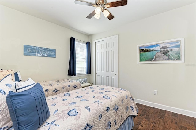 bedroom with dark hardwood / wood-style flooring, ceiling fan, and a closet