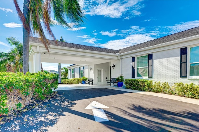 exterior space with a carport