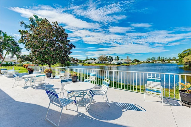 view of patio with a water view