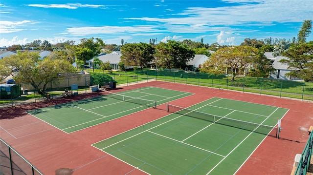 view of tennis court with basketball hoop