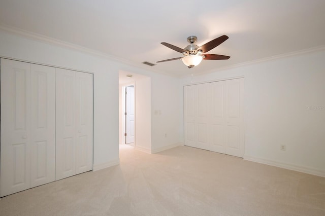 1542 Oak St Unit 6, Sarasota, FL 34236 - unfurnished bedroom featuring crown molding, carpet flooring, and a ceiling fan