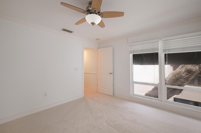 1542 Oak St Unit 6, Sarasota, FL 34236 - unfurnished room featuring ceiling fan, carpet flooring, and ornamental molding