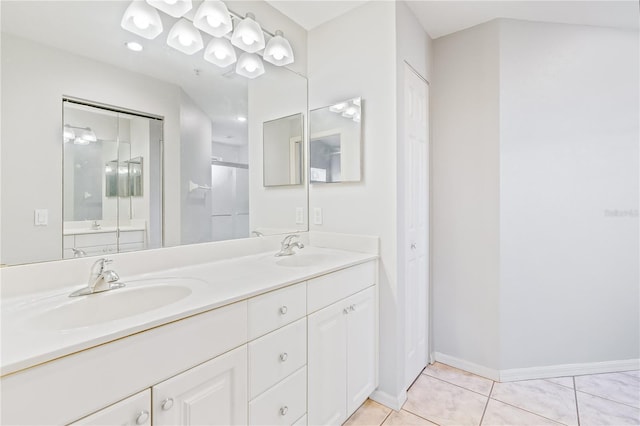 bathroom featuring vanity, tile patterned flooring, and an enclosed shower