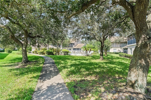 view of home's community with a lawn