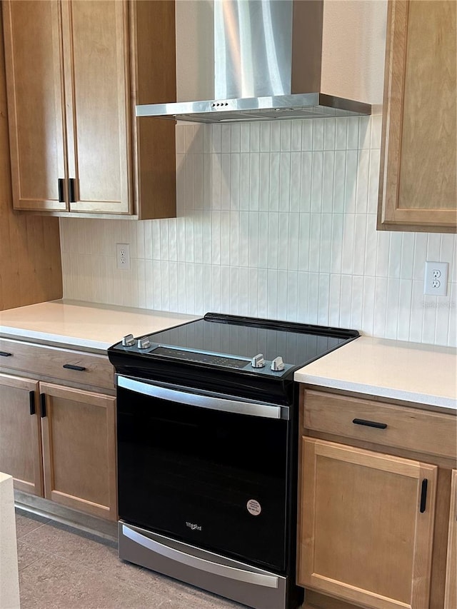 11718 Capstan Pl, Parrish, FL 34219 - kitchen featuring stainless steel range with electric stovetop, wall chimney range hood, tasteful backsplash, and light countertops