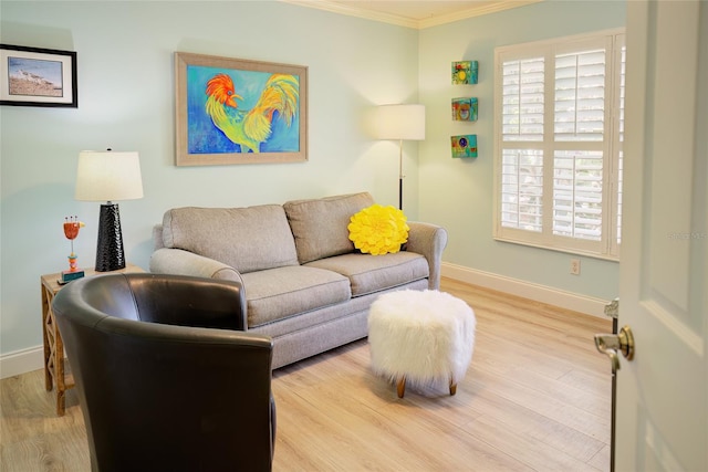 living room featuring light wood-type flooring and ornamental molding