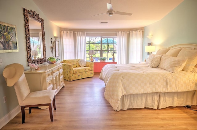 bedroom featuring light hardwood / wood-style flooring and ceiling fan