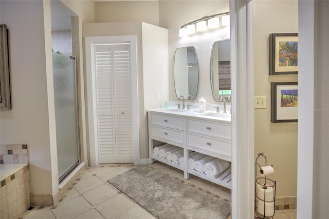 bathroom featuring tile patterned flooring, independent shower and bath, and vanity