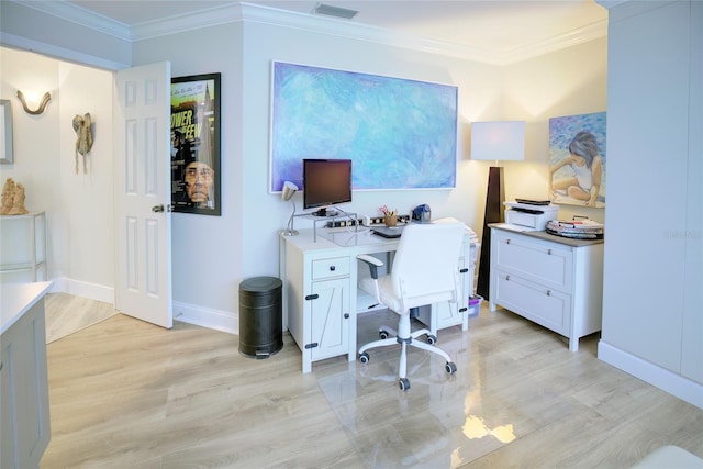 office space featuring crown molding and light hardwood / wood-style floors