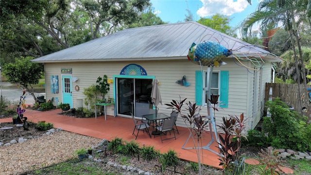 back of property with a patio