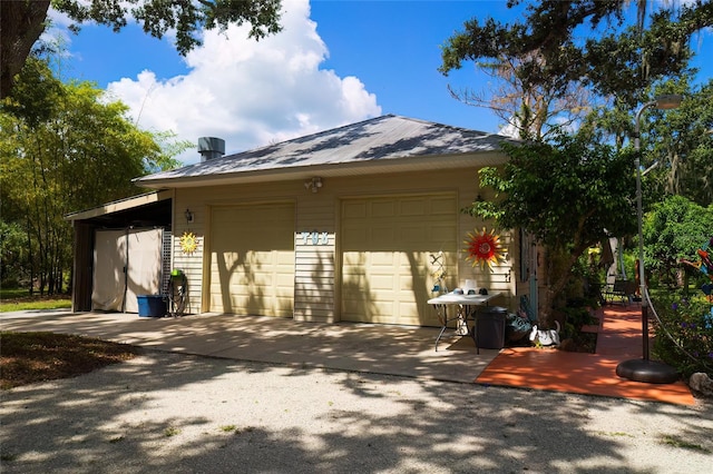 exterior space featuring an outbuilding and a garage