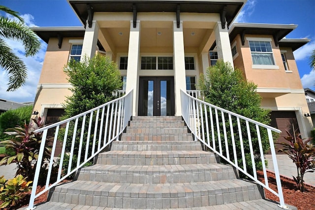 entrance to property featuring french doors