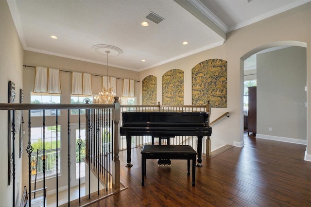 sitting room featuring a healthy amount of sunlight, dark hardwood / wood-style flooring, and crown molding