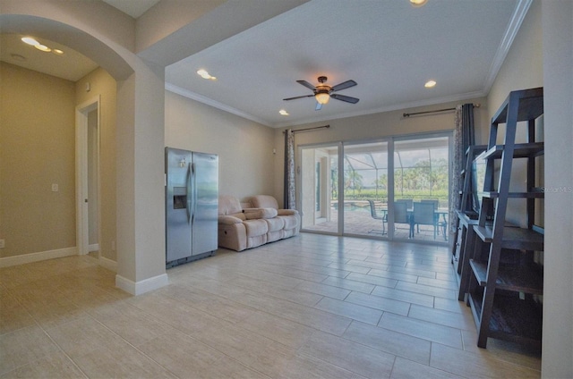 living room featuring ceiling fan and ornamental molding