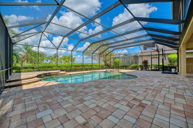 view of pool featuring a patio area and a lanai